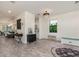 Open-concept living area with modern décor and seamless flow to the kitchen and dining spaces at 2427 Carnation Ct, North Port, FL 34289