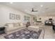 Spacious living room with large area rug, stylish furnishings, and plenty of natural light at 2427 Carnation Ct, North Port, FL 34289
