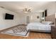 Bright main bedroom featuring hardwood floors, modern design and an ensuite bathroom at 2427 Carnation Ct, North Port, FL 34289