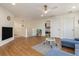 Spacious upstairs playroom with hardwood floors and a white safety gate at 2427 Carnation Ct, North Port, FL 34289