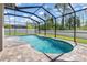 Private pool with brick pavers in screened enclosure at 2427 Carnation Ct, North Port, FL 34289