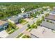 An aerial street view of the home highlights the neighborhood's manicured lawns and lush landscaping at 2427 Carnation Ct, North Port, FL 34289