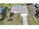 A bird's-eye view showcases a beautiful home with a pool and a well-kept landscape at 2621 Larkspur Dr, Punta Gorda, FL 33950