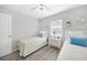 Bright bedroom shows two twin beds, accent pillows, and modern ceiling fan at 2621 Larkspur Dr, Punta Gorda, FL 33950