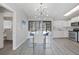 The eat-in kitchen features modern appliances, white cabinetry, and access to the screened-in lanai at 2621 Larkspur Dr, Punta Gorda, FL 33950