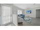 Bright living room with a neutral color palette, laminate floors, and a sliding glass door at 2621 Larkspur Dr, Punta Gorda, FL 33950