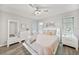 Bright main bedroom boasts stylish décor and modern ceiling fan with lighting at 2621 Larkspur Dr, Punta Gorda, FL 33950