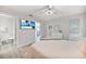 The main bedroom features a TV, neutral walls, and ensuite bathroom access at 2621 Larkspur Dr, Punta Gorda, FL 33950