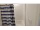 Bright bathroom with white subway tile and stylish striped shower curtain at 26456 View Dr, Punta Gorda, FL 33983