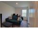 Bedroom with a couch, desk and a window offering plenty of light at 26456 View Dr, Punta Gorda, FL 33983