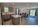 Modern eat-in kitchen featuring stainless steel appliances, island, tile floor, and an open floor plan at 26456 View Dr, Punta Gorda, FL 33983