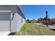 Exterior view of the house showing siding and the side of the garage at 26456 View Dr, Punta Gorda, FL 33983
