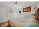 Charming bedroom with ample natural light, hardwood floors, and ceiling fan at 2666 Barry Rd, North Port, FL 34286