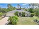Charming home with a well-manicured lawn and meticulous landscaping at 2666 Barry Rd, North Port, FL 34286