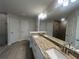 Modern bathroom featuring a double vanity with granite countertops and a spacious walk-in shower at 337 Rosario St, Punta Gorda, FL 33983