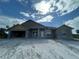 Exterior view of a single Gathering home featuring a white front door and neutral toned paint at 337 Rosario St, Punta Gorda, FL 33983