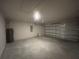 A spacious two car garage featuring light grey walls and a concrete floor at 337 Rosario St, Punta Gorda, FL 33983