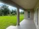 View of the home's covered patio and back yard featuring green grass at 337 Rosario St, Punta Gorda, FL 33983