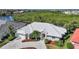 This home features a white roof, beautiful landscaping, and a serene mangrove backdrop at 3513 Dileuca St, Punta Gorda, FL 33950