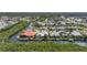 Aerial view of waterfront homes in a neighborhood on a canal with mature trees and tropical landscaping at 3513 Dileuca St, Punta Gorda, FL 33950