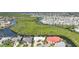 An aerial view of a community with lush surroundings, homes sit on canals offering serene waterfront living at 3513 Dileuca St, Punta Gorda, FL 33950