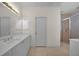 Spacious bathroom with a large vanity, shower, and linen storage at 3513 Dileuca St, Punta Gorda, FL 33950