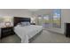 Inviting bedroom featuring soft carpet and an ensuite entrance to the pool deck at 3513 Dileuca St, Punta Gorda, FL 33950