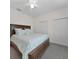 Bedroom featuring queen bed with a leafy comforter and two closets with folding doors at 3513 Dileuca St, Punta Gorda, FL 33950