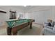 Spacious game room featuring a pool table, seating, and neutral colors at 3513 Dileuca St, Punta Gorda, FL 33950