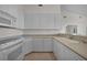 Spacious kitchen with all-white cabinetry, appliances, and plenty of counter space at 3513 Dileuca St, Punta Gorda, FL 33950