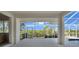 Covered lanai featuring tropical landscaping, and a waterway view at 3513 Dileuca St, Punta Gorda, FL 33950