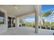 Screened lanai with outdoor seating and views of lush foliage and a waterway at 3513 Dileuca St, Punta Gorda, FL 33950