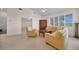 Bright living room with high ceilings and neutral-toned furniture at 3513 Dileuca St, Punta Gorda, FL 33950