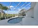 Screened pool with tropical landscaping and a waterway view at 3513 Dileuca St, Punta Gorda, FL 33950