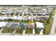 Neighborhood shot with mature landscaping showing how close you are to local stores, dining, and entertainment at 3520 Kenneth Rd, Port Charlotte, FL 33953