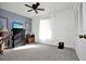 Comfortable bedroom with carpet flooring and ample natural light from the window at 3520 Kenneth Rd, Port Charlotte, FL 33953