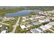 Expansive aerial view showing a waterfront community with varied home styles and lush landscaping at 3520 Kenneth Rd, Port Charlotte, FL 33953
