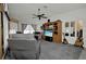 Comfortable living room with vaulted ceiling, ceiling fan, entertainment center, and neutral decor at 3520 Kenneth Rd, Port Charlotte, FL 33953