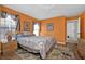 Inviting primary bedroom featuring natural lighting and wood flooring at 3520 Kenneth Rd, Port Charlotte, FL 33953