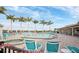 Community pool area with multiple seating options creating a relaxing environment that embodies Florida's beautiful weather at 3520 Kenneth Rd, Port Charlotte, FL 33953