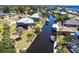 Aerial view of home with boat dock and lift on a wide canal at 3712 Balboa Ct, Punta Gorda, FL 33983