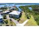 Aerial view of the home showcasing the property's canal-front location and outdoor amenities at 3712 Balboa Ct, Punta Gorda, FL 33983