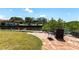 Waterfront backyard featuring a brick patio seating area and view of the canal and boat dock at 3712 Balboa Ct, Punta Gorda, FL 33983