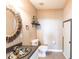Charming bathroom with a colorful sink, a decorative mirror, and well-lit fixtures at 3712 Balboa Ct, Punta Gorda, FL 33983