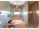 Inviting bathroom with a soaking tub and glass-enclosed shower at 3712 Balboa Ct, Punta Gorda, FL 33983