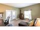 Inviting bedroom with a comfortable chaise lounge and a view to the exterior at 3712 Balboa Ct, Punta Gorda, FL 33983