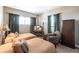Cozy bedroom with two twin beds, natural light, and vintage-inspired decor at 3712 Balboa Ct, Punta Gorda, FL 33983
