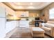 Cozy open-concept kitchen, featuring white cabinetry and modern appliances at 3712 Balboa Ct, Punta Gorda, FL 33983