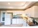 Well-equipped kitchen with white cabinets and appliances at 3712 Balboa Ct, Punta Gorda, FL 33983