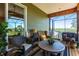Relaxing screened patio featuring comfortable seating, wood-look flooring, and calming views at 3712 Balboa Ct, Punta Gorda, FL 33983